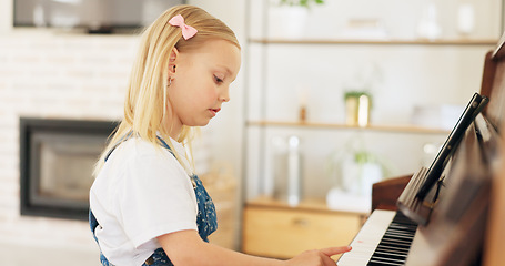 Image showing Development, young girl and piano for learning, practice and keys for instrument being focus, concentrate and educate. Music, tablet and child education for playing, lesson and training art at home.
