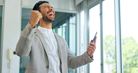 Image showing Success, phone and winner with businessman in office and celebration for deal, growth and stock market target. Wow, goals and good news with fist of employee for achievement, future and sale