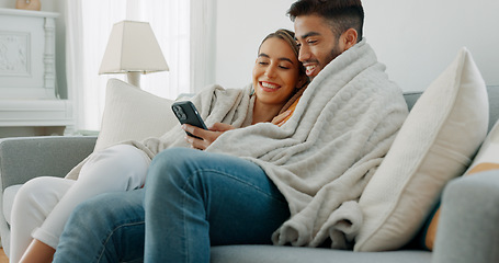 Image showing Happy, couple with phone for communication, networking or social media app at home. Movie, video or love man and woman relax in living room streaming online, internet or website with smile in house