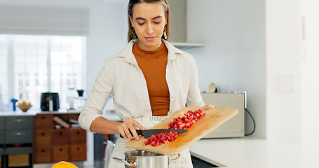 Image showing Woman, cooking and kitchen, vegetable and nutrition, board and knife, healthy food and diet at home. Young, chef and chop pepper with tomato, nutritional meal and fresh, organic and raw.