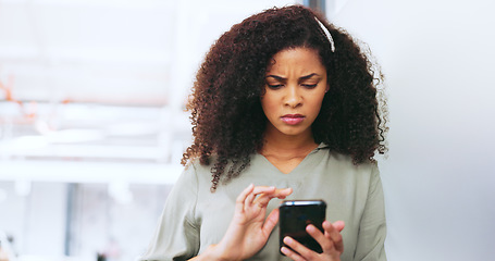 Image showing Phone, black woman and frustrated frown of a person on digital communication reading fake news. Annoyed woman on web, internet and social media scroll confused about digital media reading in a office