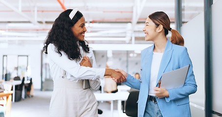 Image showing Business women, handshake and welcome, introduction and hello to new intern while walking in office. Happy, excited and diversity workers shaking hands for support, teamwork or onboarding partnership