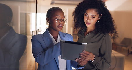 Image showing Business people, tablet or talking in night office for digital marketing startup, creative company or project management teamwork. Designer, worker or black woman on technology for strategy planning