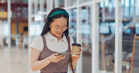 Image showing Phone, mall and Asian woman typing, social media or messaging. Technology, coffee and happy female with mobile smartphone for networking, internet browsing or web scrolling alone at shopping mall.