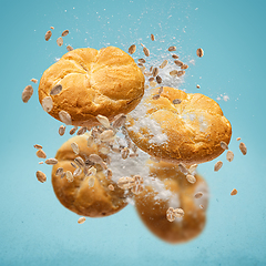 Image showing Delicious buns flying in air