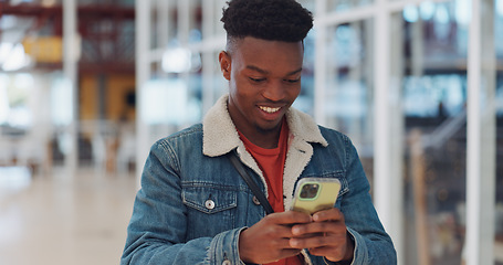 Image showing Creative black man, phone and smile for texting, communication or social media at the office. Happy African American man enjoying online conversation, discussion or chat on smartphone for startup