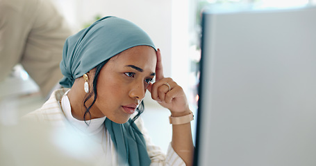 Image showing Hijab, headache and business woman burnout at a office computer feeling anxiety and stress. Finance employee, islam and muslim female at work doing tax audit at a computer worried about mistake