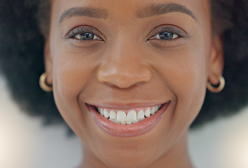 Image showing Face of an african american woman smiling and laughing with joy at the camera. Portrait of a cheerful, cool and confident female with afro hair and a positive attitude feeling excited in a good mood