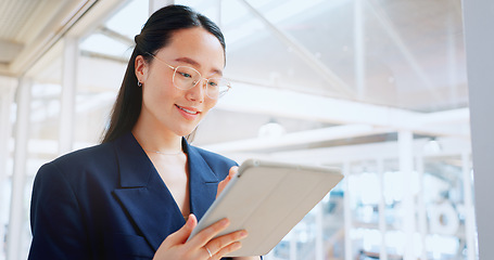 Image showing Business woman, tablet and technology, typing email for company communication or digital report. Internet, wifi and ux, networking and Asian employee with smile and inspiration in Japan office