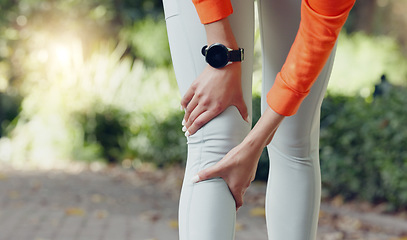 Image showing Knee injury, pain or massaging woman or runner rubbing her leg during exercise or workout outside. Wellness, health and physical therapy during cardio training with a female athlete at the park.