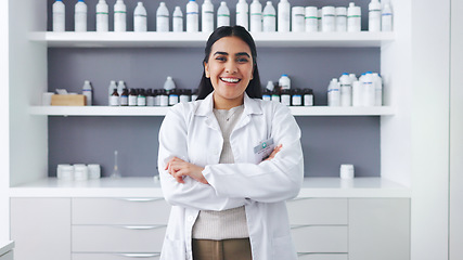 Image showing Portrait of a female scientist using a microscope in a research lab. Young biologist or biotechnology researcher working and analyzing microscopic samples with the latest laboratory tech equipment