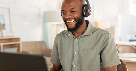 Image showing Laptop, headphones and black man on an online video call or meeting for his remote corporate job. Happy, talking and African guy on a webinar, video conference or seminar call with a computer at home