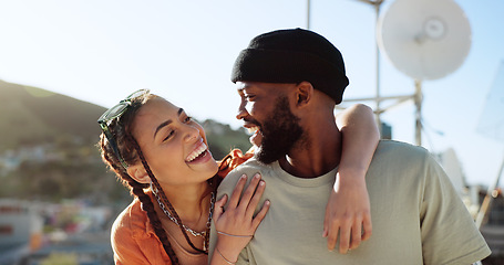 Image showing Interracial couple, hug and bonding on city building rooftop for summer holiday, travel vacation date and location break in Boston. Smile, happy black man and talking woman or student fashion friends