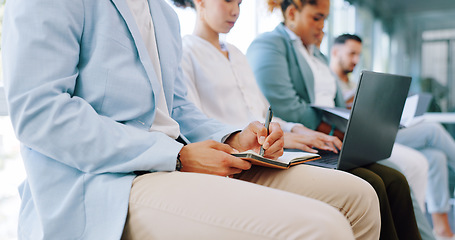 Image showing Recruitment, row and business people writing in notebook for hiring, job interview or work opportunity. Human resources, onboarding and candidates sitting with book, typing on laptop and write notes