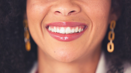 Image showing Oral hygiene closeup of a woman smiling and showing her perfect white teeth. Confident young black woman with a flawless and beautiful smile. Visit your dentist regularly for dental cleaning