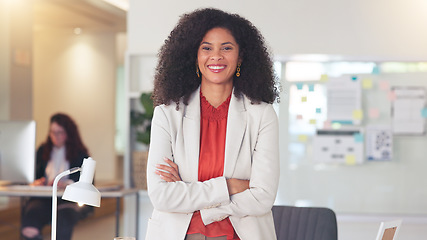 Image showing Confident human resources manager looking motivated and ambitious for success. Portrait of a black business woman standing arms crossed, smiling and feeling positive while working in an office