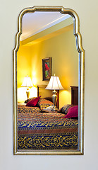 Image showing Bedroom interior reflected in mirror