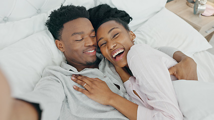 Image showing Selfie influencer couple in bed and portrait smile for fun indoor weekend or waking up together in the morning. Fun, happy black people in bedroom and a POV portrait photo for social media content