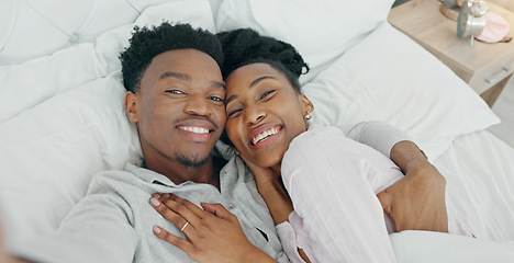 Image showing Selfie influencer couple in bed and portrait smile for fun indoor weekend or waking up together in the morning. Fun, happy black people in bedroom and a POV portrait photo for social media content