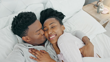 Image showing Selfie, kiss and happy influencer couple vlogging their honeymoon while lying in bed to love and relax together at home. Portrait of a loving black man and woman having romantic moment in the morning