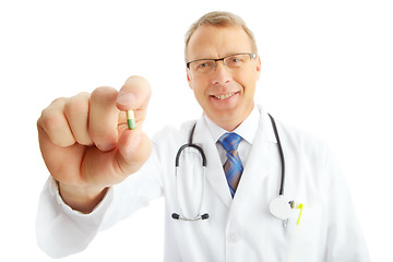 Image showing Face, doctor and man with pills in studio isolated on a white background. Portrait, healthcare and happy medical worker, pharmacist and mature male holding drug medicine, medication or capsule remedy