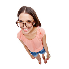 Image showing Woman, happy and portrait of a model with glasses, smile and casual fashion. White background, happiness and isolated young person looking up with eyewear in a studio feeling positive and calm