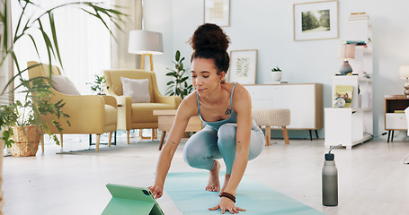Image showing Exercise, yoga and tablet with fitness woman streaming online class, tutorial or live stream on internet virtual training in lounge at home. Fit female using technology for spiritual wellness workout
