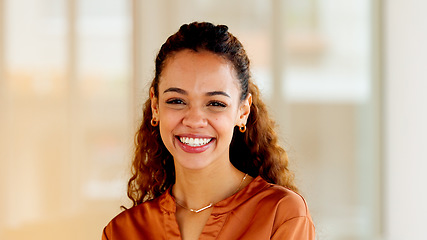 Image showing Latino business woman smiling and laughing with joy in an office. Portrait of a confident and ambitious young entrepreneur feeling motivated, empowered and optimistic for success in a startup company