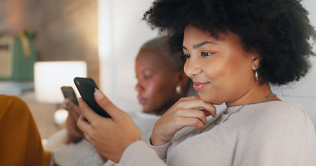 Image showing Social media phone, home relax and friends in communication on mobile app, search the internet and smile for notification. African women on the living room sofa with mobile internet connection