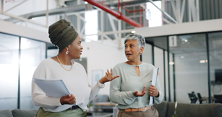 Image showing Business women, conversation and modern office for marketing strategy, planning and busy. Female employees, manager and worker in workplace, advertising campaign and startup company schedule and talk