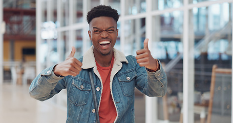 Image showing Thumbs up, black man and celebrate success in trendy startup, marketing agency and motivation for winning, goals and agreement. Happy worker, hipster and guy thumb up in support, trust and hand emoji