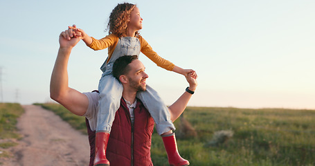 Image showing Happy, father and child on shoulders in the countryside enjoying quality bonding time together in nature. Dad giving his little girl a piggyback with smile, love and care for the natural environment