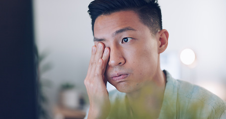 Image showing Asian businessman, tired and hand on face in communication office, headache and marketing company. Man, computer or late night reading with burnout, target or kpi at digital marketing agency in Tokyo