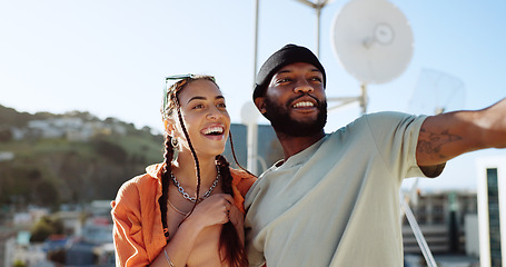 Image showing Couple, bonding or talking on city rooftop and pointing, sightseeing Portugal or enjoying summer holiday vacation view. Smile, happy and love black man and interracial fashion woman on location date