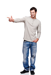 Image showing Happy, idea and man pointing hand in direction with excited, curious and thinking expression. Happiness of model contemplating solution or choice with smile at isolated white background