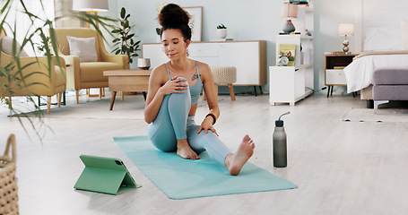 Image showing Exercise, yoga and tablet with fitness woman streaming online class, tutorial or live stream on internet virtual training in lounge at home. Fit female using technology for spiritual wellness workout