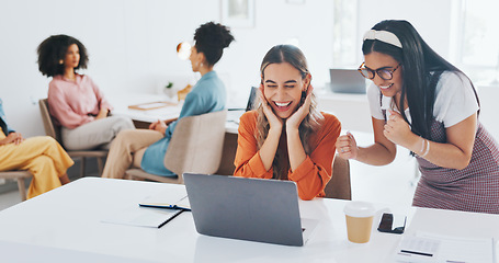 Image showing Success, fist bump or happy employees with a handshake in celebration of digital marketing sales goals at office desk. Laptop, winner or excited women celebrate winning an online business deal at job