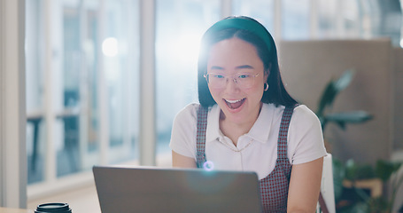 Image showing Asian woman, laptop and celebration fist for company success, creativity goals and happiness in office. Digital marketing achievement, happy or excited employee celebrate for corporate target winner