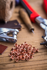 Image showing Brass eyelets and eyelet punch