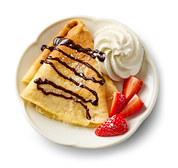 Image showing freshly baked crepe with whipped cream