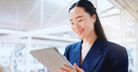 Image showing Business woman, tablet and technology, typing email for company communication or digital report. Internet, wifi and ux, networking and Asian employee with smile and inspiration in Japan office