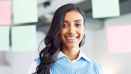 Image showing Portrait of a proud female intern looking confident of her brainstorm research idea on a digital tablet while working in an office at work. The face of one happy student searching the web online