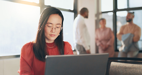 Image showing Business, technology and Asian woman in office, working with team on laptop, tablet and computer in workplace. Success, teamwork and female worker walking, meeting and planning for digital marketing