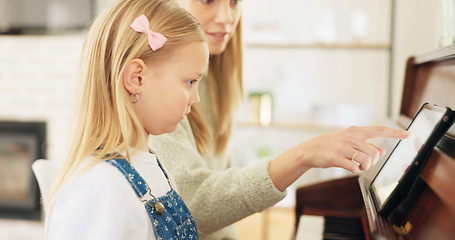 Image showing Music development, girl learning piano and musical note education from mom in the home living room. A child musician playing keys, learn creative audio art and fun concert performance in family house