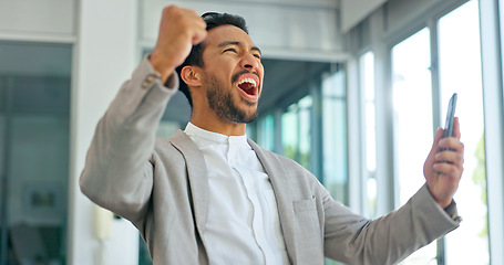 Image showing Success, phone and winner with businessman in office and celebration for deal, growth and stock market target. Wow, goals and good news with fist of employee for achievement, future and sale