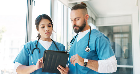 Image showing Healthcare, surgeon or nurse team with a tablet talking, planning and communication about a surgery. Man and woman hospital staff meeting using technology for research, innovation and medicine