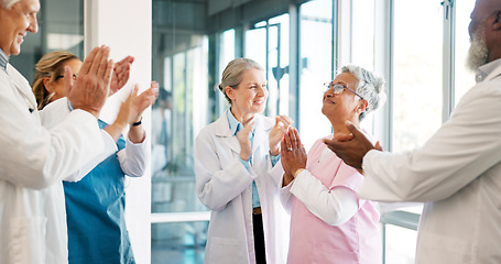 Image showing Doctor, nurse and team applause in celebration for healthcare achievement, goal or promotion at hospital. Group of medical professional clapping and celebrating teamwork, unity or victory at clinic