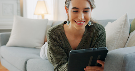 Image showing Woman, digital tablet and living room app, typing and reading ebook, online shopping and 5g multimedia technology on sofa home lounge. Relax girl on social media, internet website and wifi connection