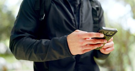 Image showing Man, hands and phone for hiking gps, location or map in Australian forest, nature woods or sustainability environment. Zoom, hiker and backpacking person on mobile technology for fitness training app