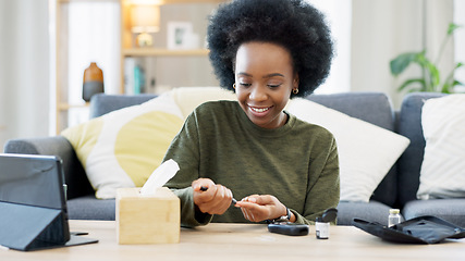 Image showing Happy African American woman using a glucose monitoring device at home. Smiling black female checking her sugar level with a rapid test result kit, daily routine of diabetic care in a living room